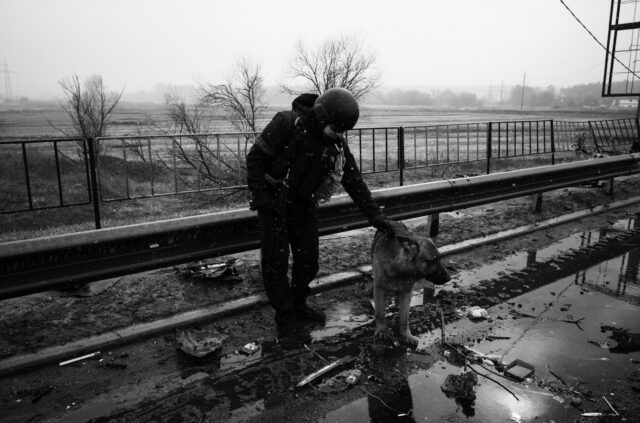 Inspecting the tremendous damage from the hard fight to liberate the city the night before. The battle involved tanks of opposing forces fighting face to face in a direct no-way-out confrontation.