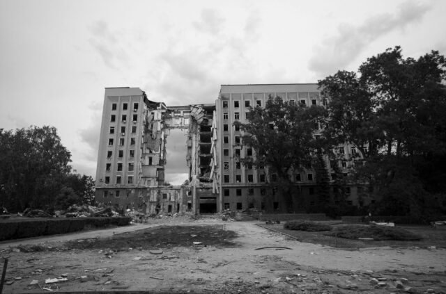 A destroyed apartment buidling, a ricket or missile left a big hole.