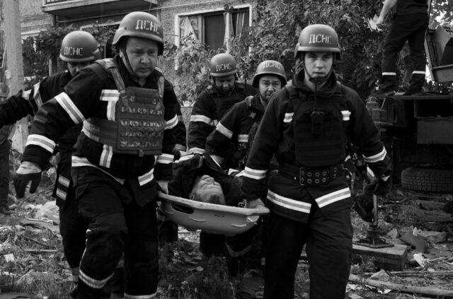 Evacuation of wounded people by emergency services from an apartment building in Mykolaiv after a Russian missile attack, 29 June - 2022.