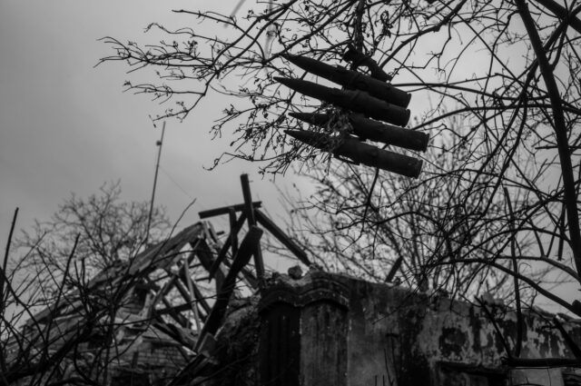 Ammunition haning in a tree. Leftovers, traces, signs from the fighting and shelling.