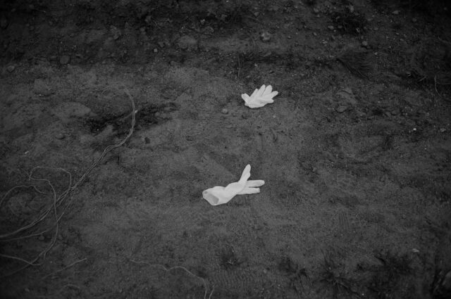 Forensic gloves lying on the ground used by a special forensic unit.