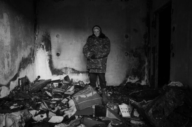 Natali in her destroyed apartment home.