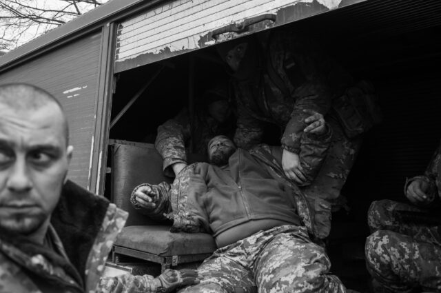 A Ukrainian serviceman suffers from a stroke on the road to the Bakhmut frontline
